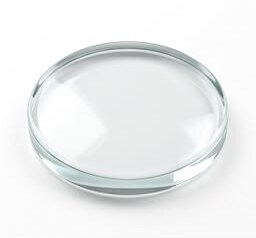 Clear mineral glass lens with a thick edge